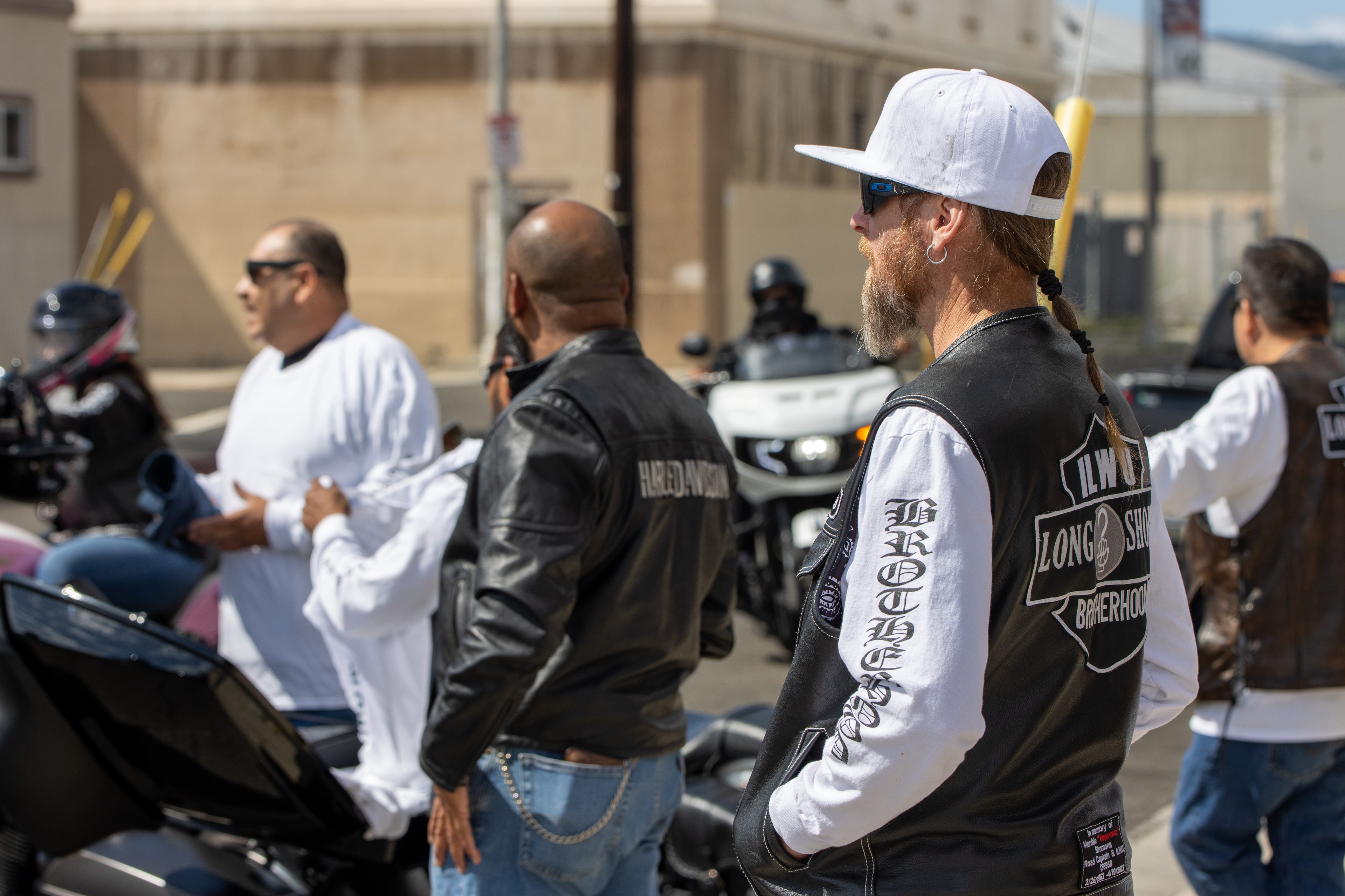 Motorcycle club members gathering outdoors
